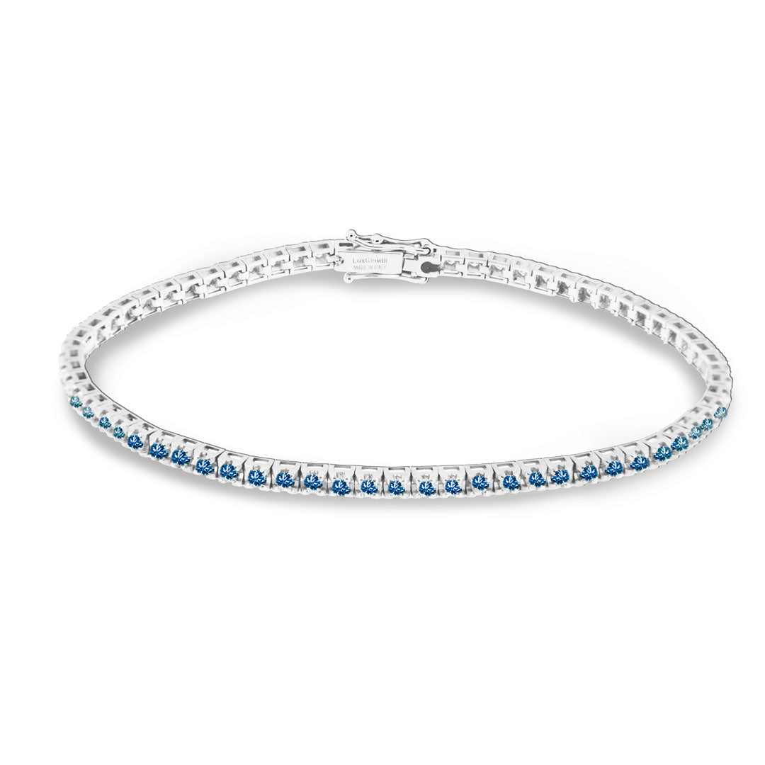 Bracciale tenni in oro bianco e zaffiri blu